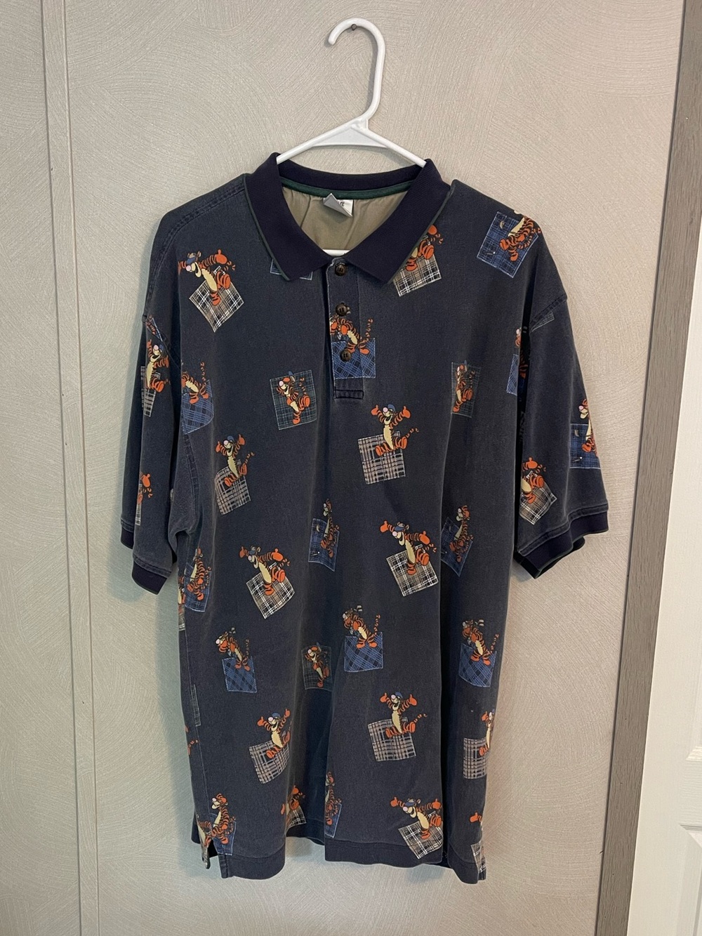 ￼
Vintage 90s Disney Store Tigger All-Over Print Polo Shirt